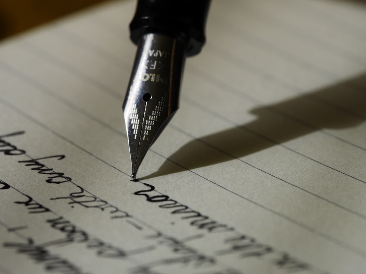 Editor reviewing handwritten notes beside a printed draft