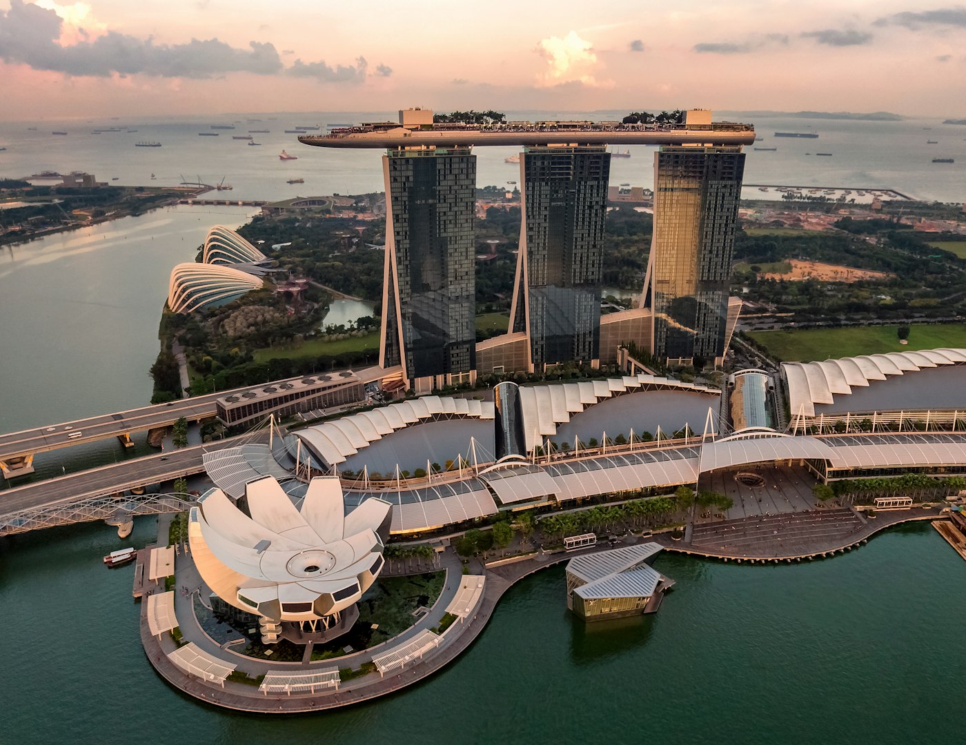 Singapore harbour and skyline at dawn with cargo terminals along the water
