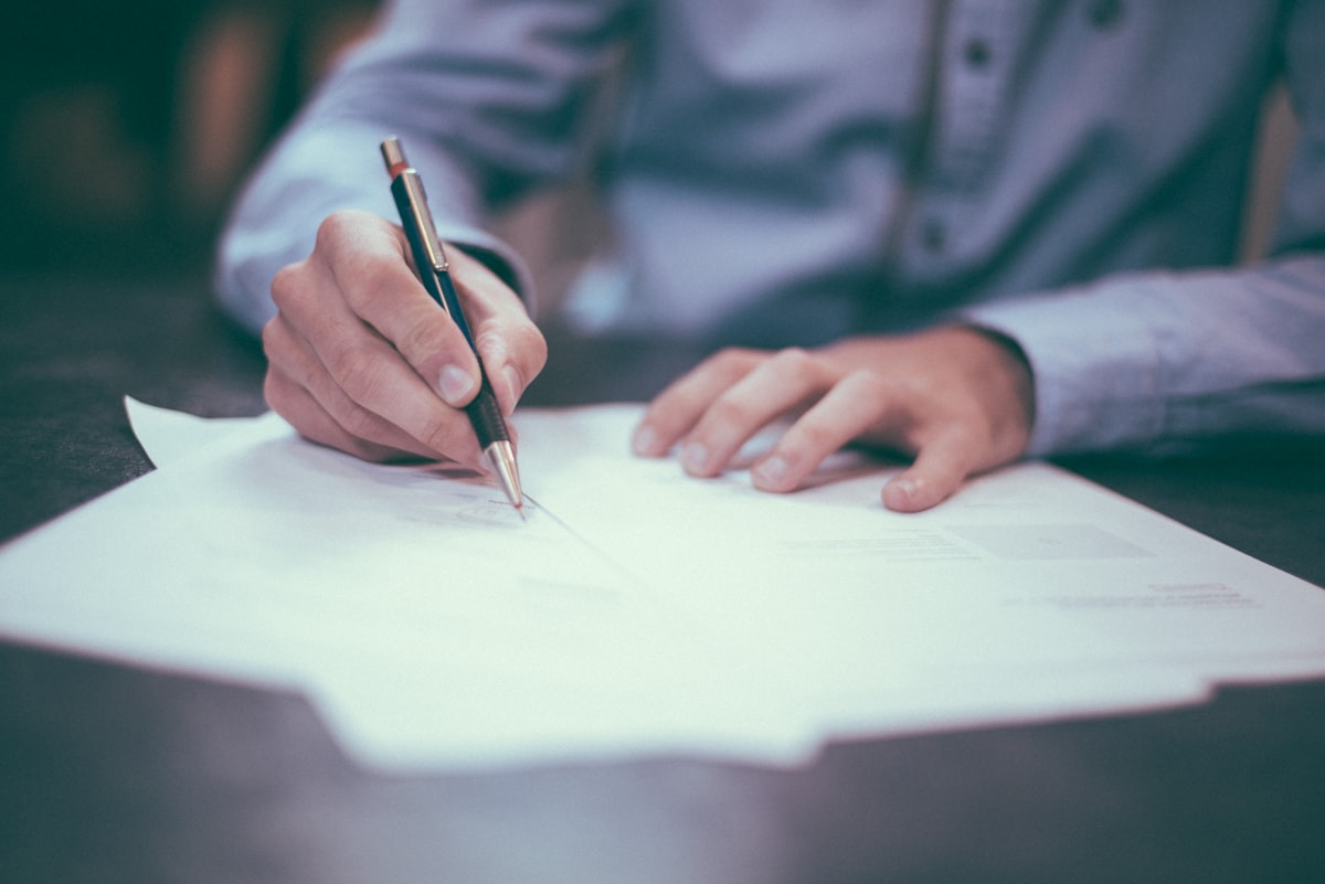 Policy papers, pens, and a notebook on an editor’s desk